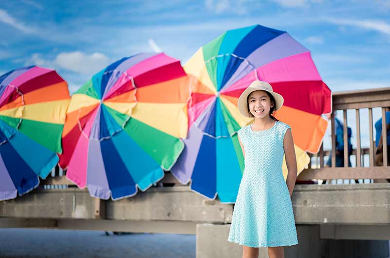 Clear Water beach portrait by umbrella